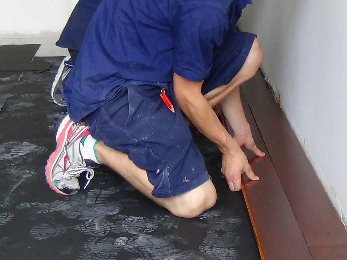 A1 AcoustaMat Underlay being laid under floor boards