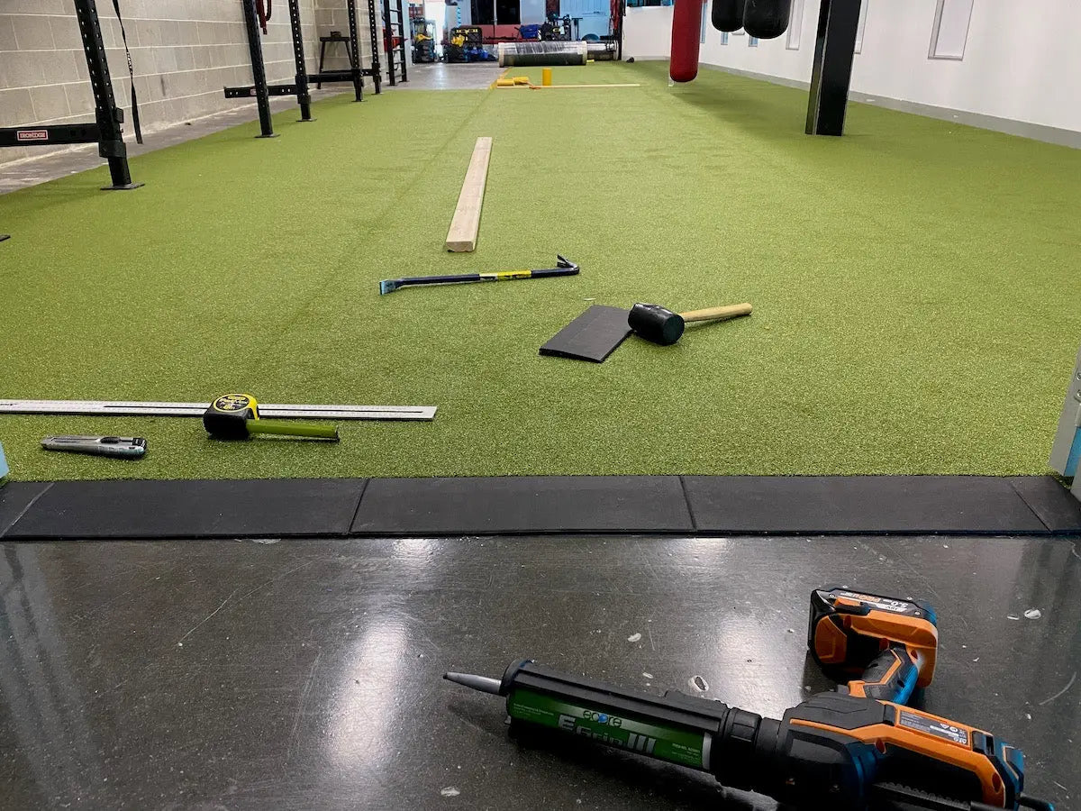 Legend 15mm Gym Tile Ramps installation against Gym Turf