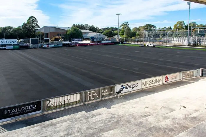 A1 AeroRoll Rubber Shock Pad being installed on a football pitch