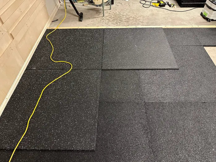 A1 Olympact Rubber Underlay installation under gym tiles