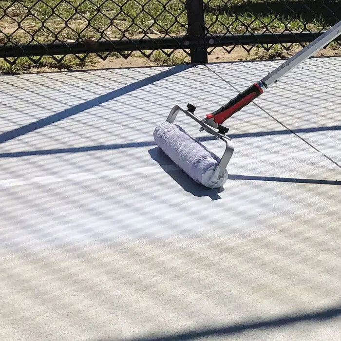 Mapei Mapecoat TNS Primer EPW being rolled on to a tennis court