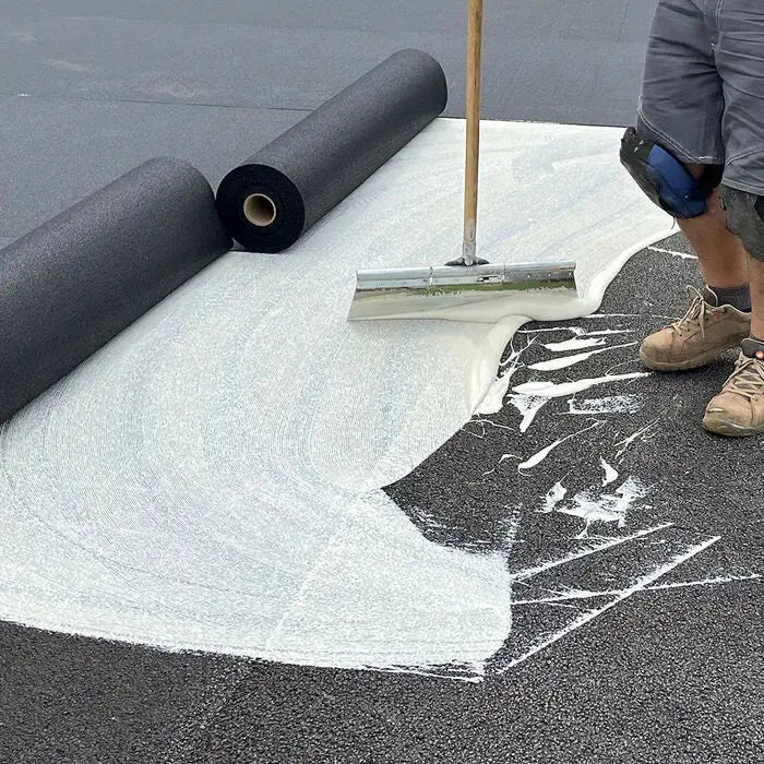 Mapei Ultrabond Sport being applied with a stand up trowel