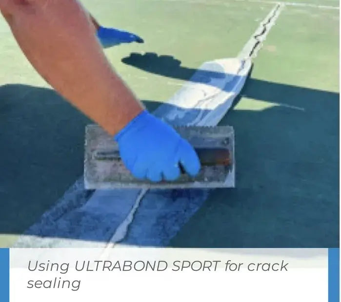 Mapei Ultrabond Sport being applied with a trowel fill cracks