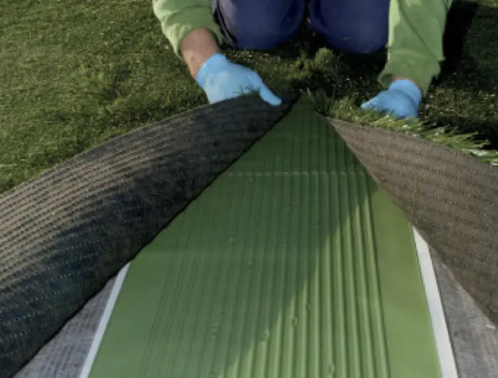 Mapei Ultrabond Turf Tape being used to install aritificial turf